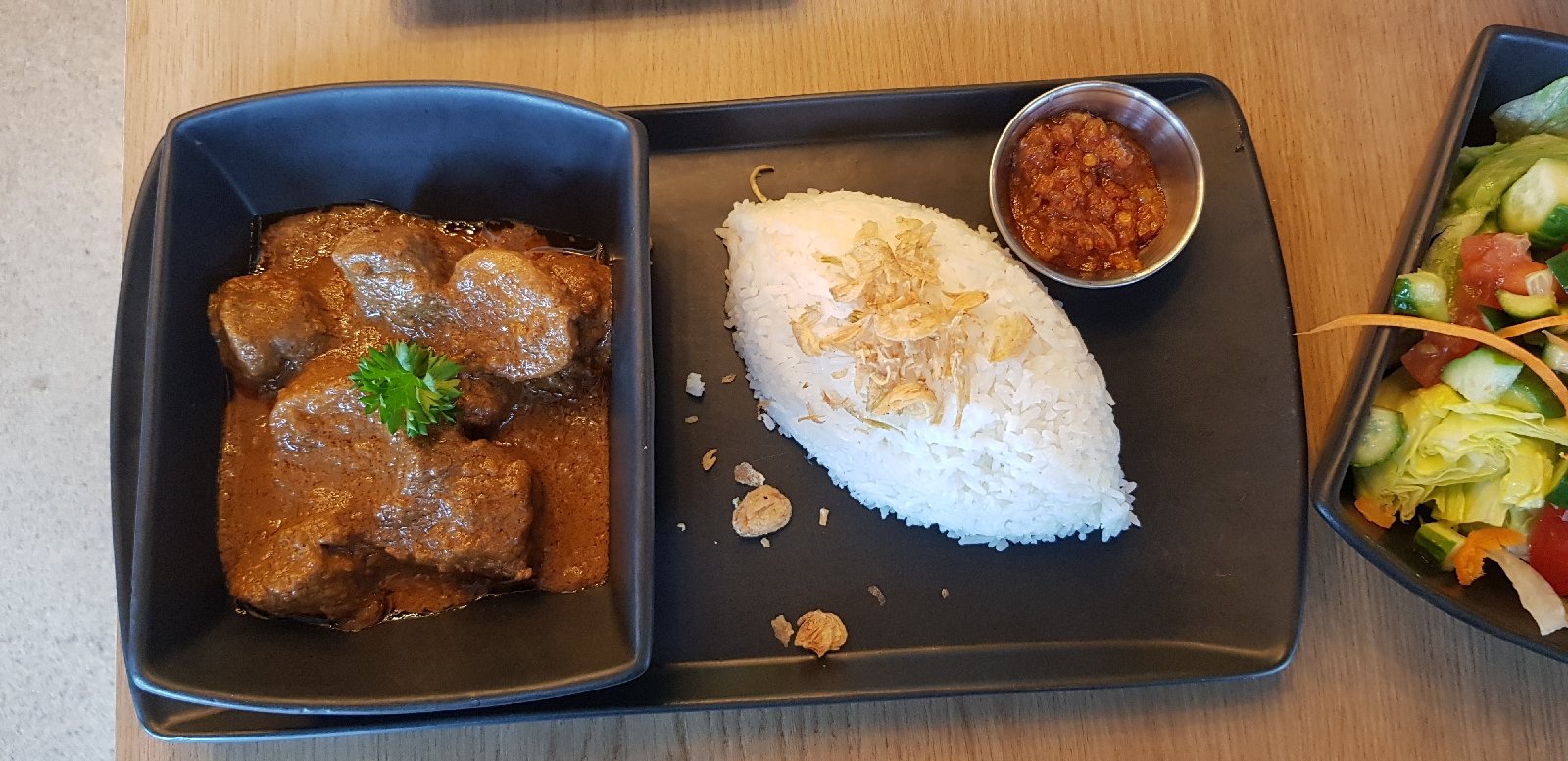 Beef rendang with rice and sambal and salad!
