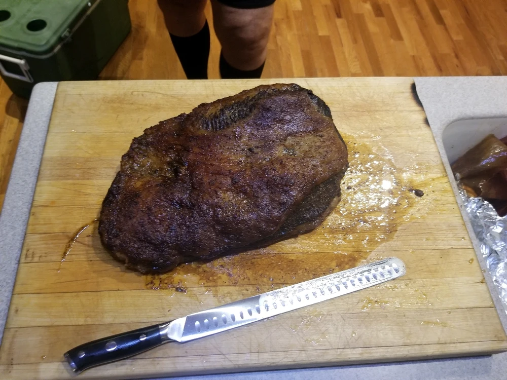 Smoked brisket with pecan and maple smoke. Perfect crust, and the point literally melts in your mouth.