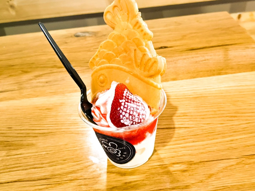 Upsidedown Taiyaki with vanilla ice cream, strawberry syrup, and fresh strawberries
