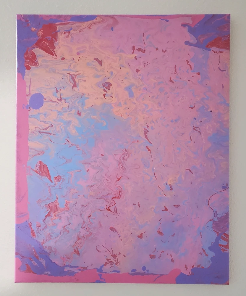 Pastel acrylic pour with splotches of red throughout. 