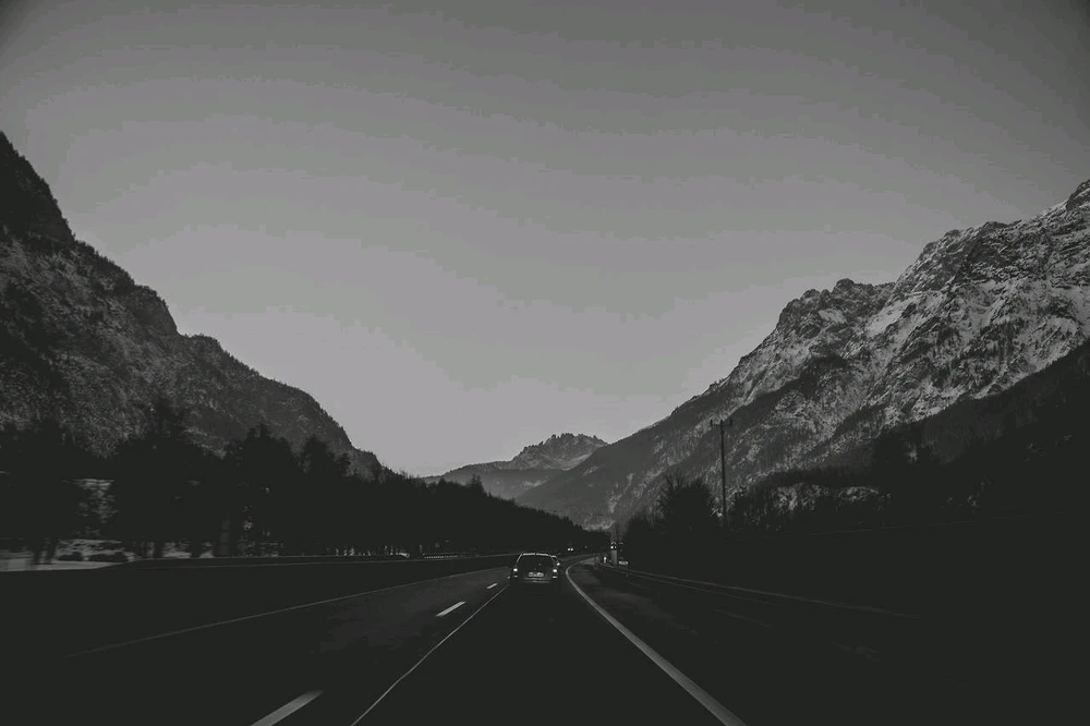 Black and white photo of a mountain road