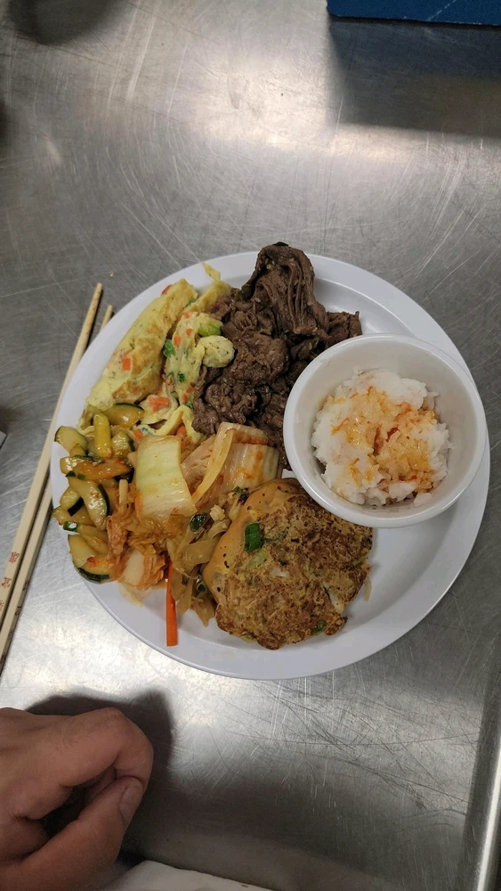 Bulgolgi beef, Korean omelet, homemade kimchi, kimchi pancakes, spicy cucumber salad, and soy sauce radish salad