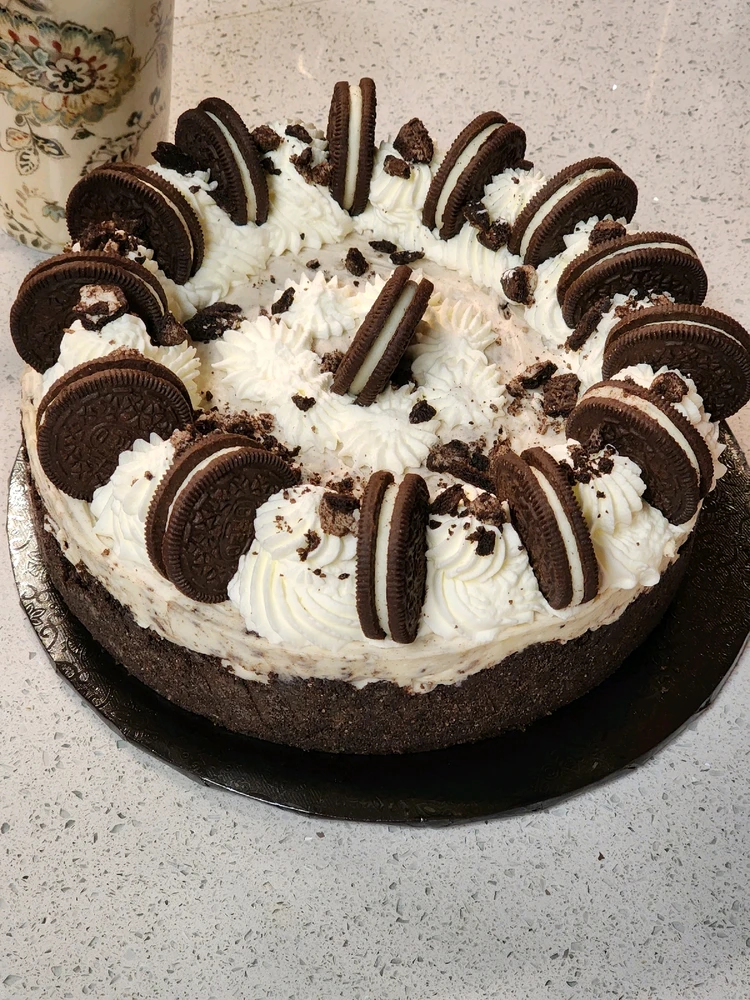 Oreos on top of a cheesecake 