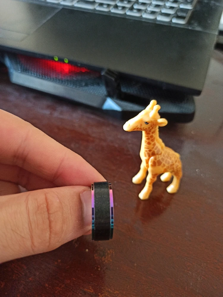 I have an asexual ring. It's a black steel ring and has some pearly colorful lines on both sides. And, there is a giraffe toy