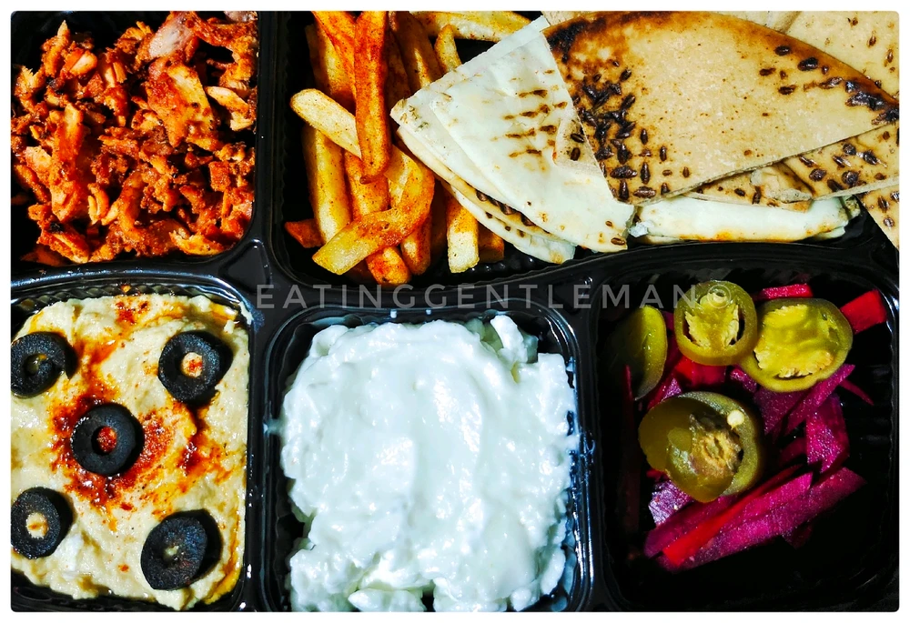 Shawarma plate, served with grilled meat, peta bread, pickled veggies. Tahini, humus... Yummy 😋 
