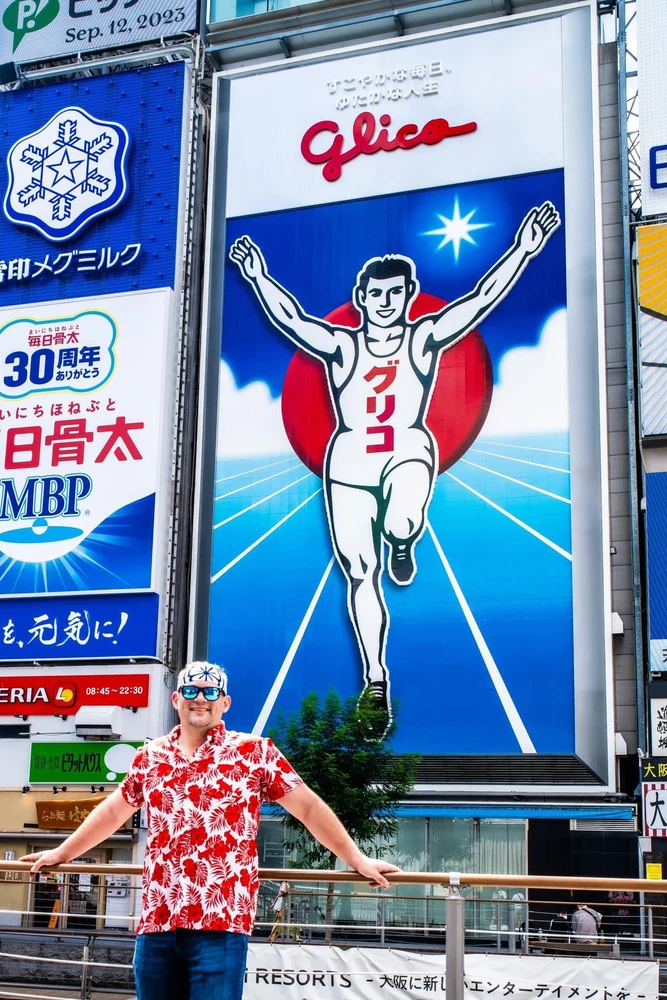 Standing in front of the Glico sign in dotonbori Osaka Japan 