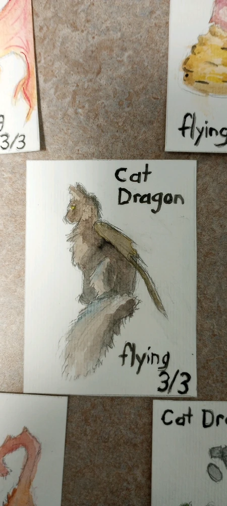 Watercolor cat with dragon wing sitting looking sideways.