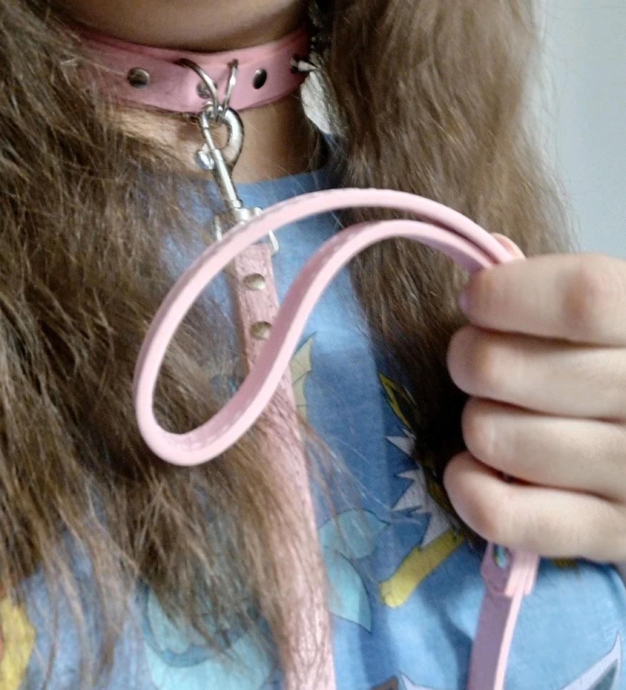 Me wearing a collar and leash