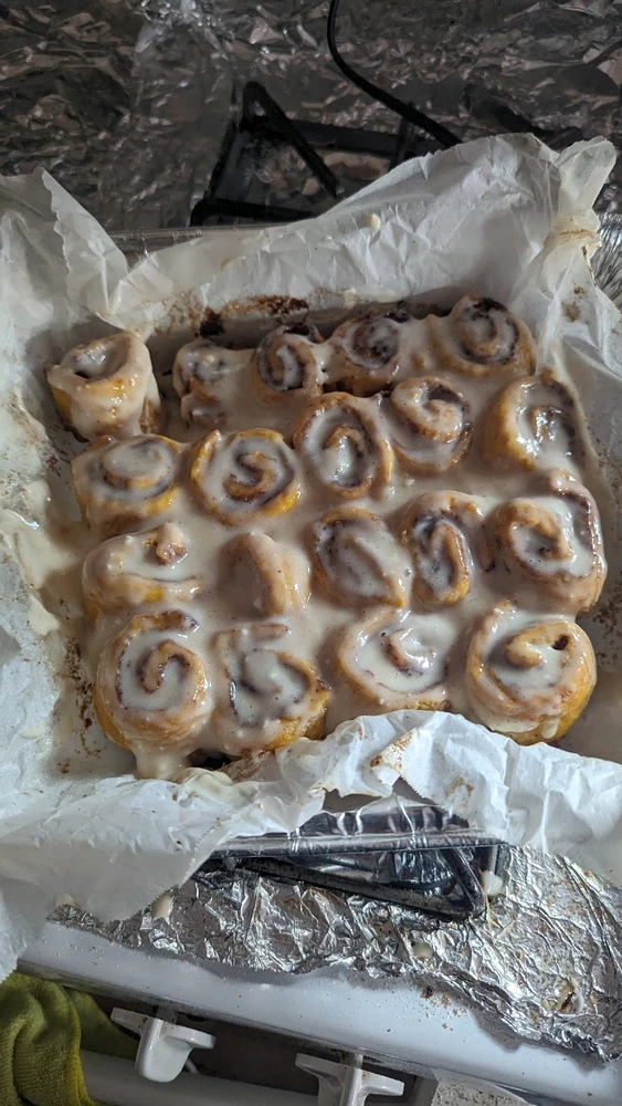 A tray of pumpkin spice cinnamon rolls 