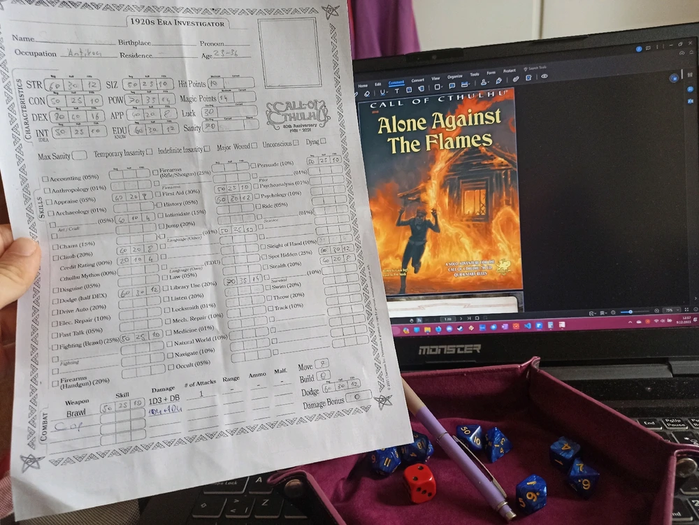 On the right a PDF file shows the cover page of Alone Against The Dark book, on the left there is a character sheet. And dice