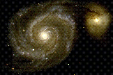 graceful, winding arms of the majestic spiral galaxy M51 appear like a grand spiral staircase sweeping through space.