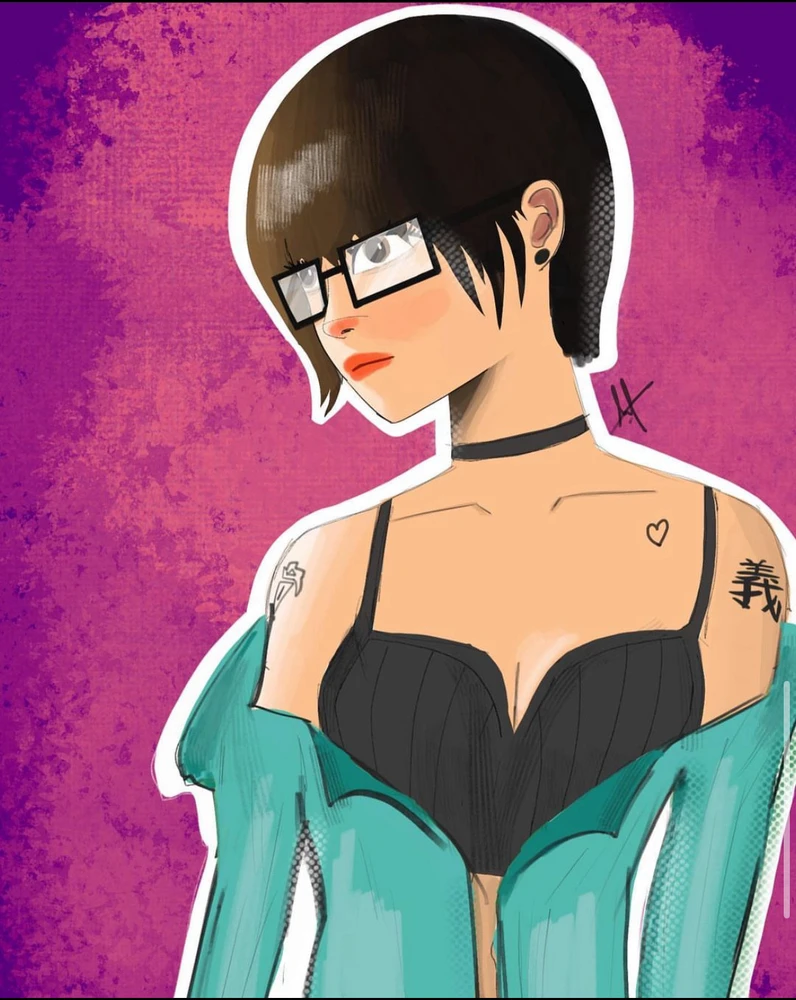 Adria, a young adult woman with tattoos and short hairs looking sideways. She also wears glasses and a jacket with a crop top