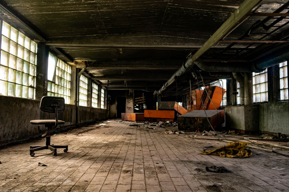 A hallway at an abandoned mining site photographed during an exploration by Siem de Nijs