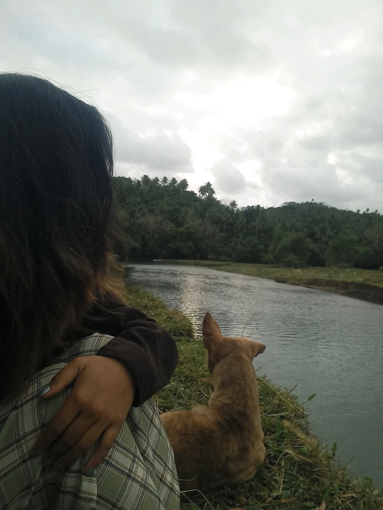 At riverside with my Happy(pet name) who always stays by my side.