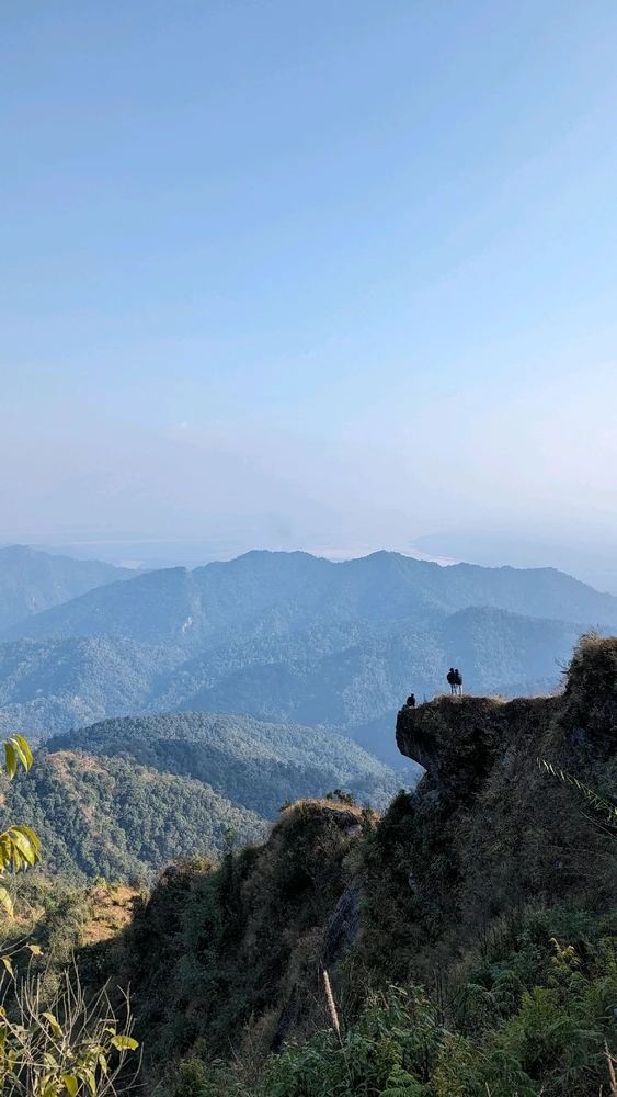 Sitting on the edge of a mountain, admiring the view that lies ahead, while my friend took the photo