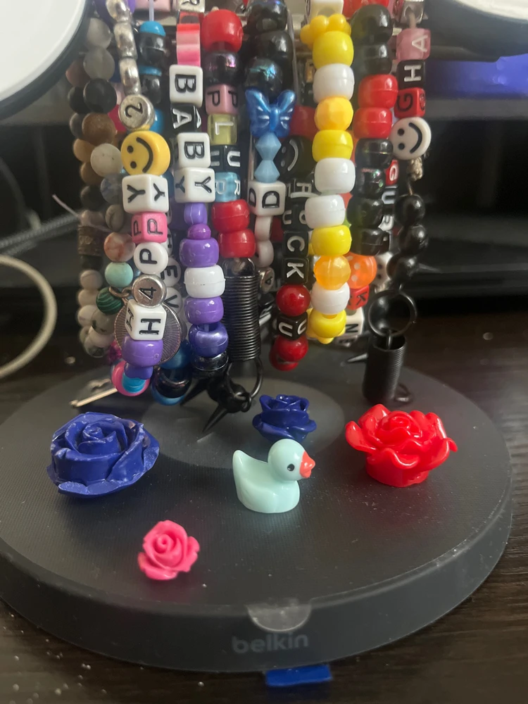 A MAGICAL BLUE DUCK, SURRONDED BY MY CUSTOM LITTLE FLOWERS AND KANDI BRACELETS.