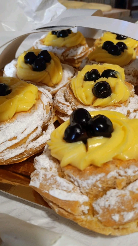 Zeppole are either fried or oven baked dessert, with crema pasticcera and chocolate.