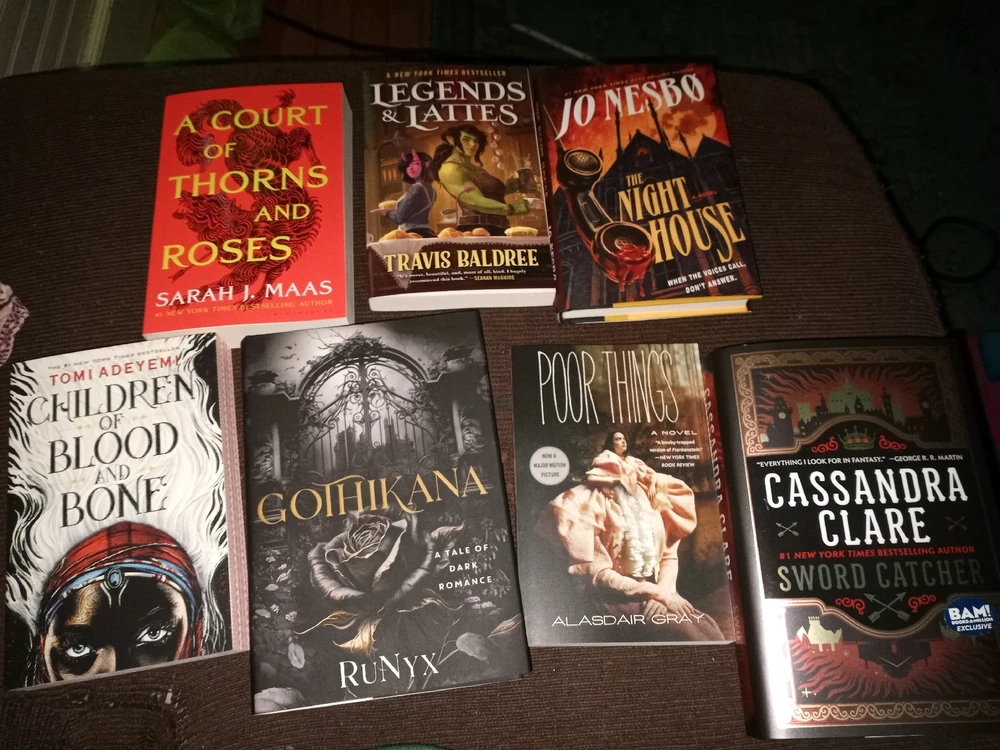 Image shows seven books laid out from the user's purchase.