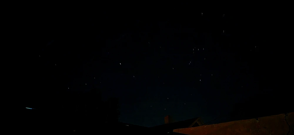 This image  shows beautiful  stars in the night sky and  trees in the sounding it's dark and peaceful 