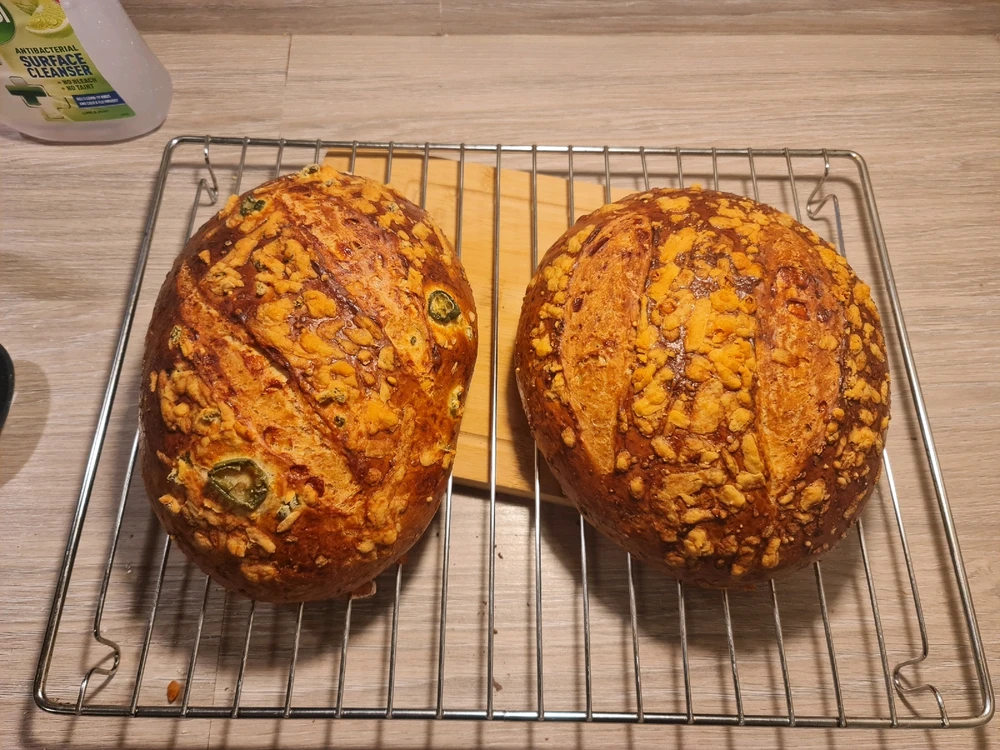 This is a photo of two different loaves of beer/ale bread, on the left, jalapeno and cheddar, on the right just cheddar