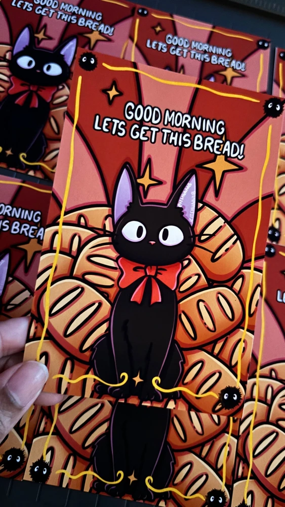 illustration of black cat from Kiki’s delivery service with bread behind him. Text reads “let’s get this bread”