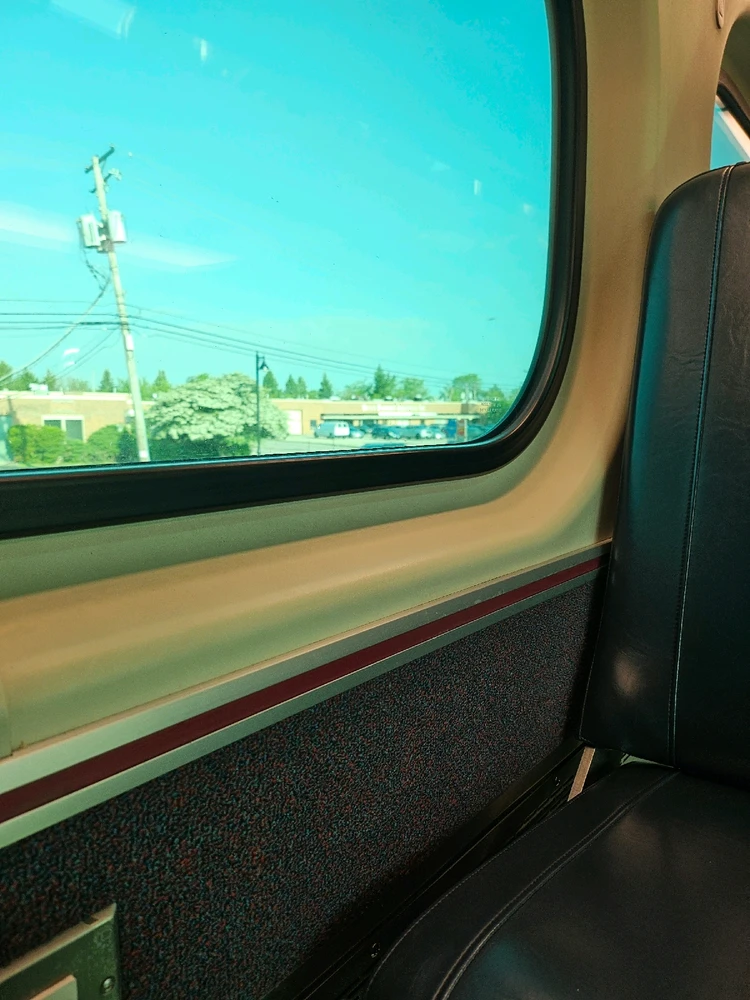 Picture of a train seat and window.