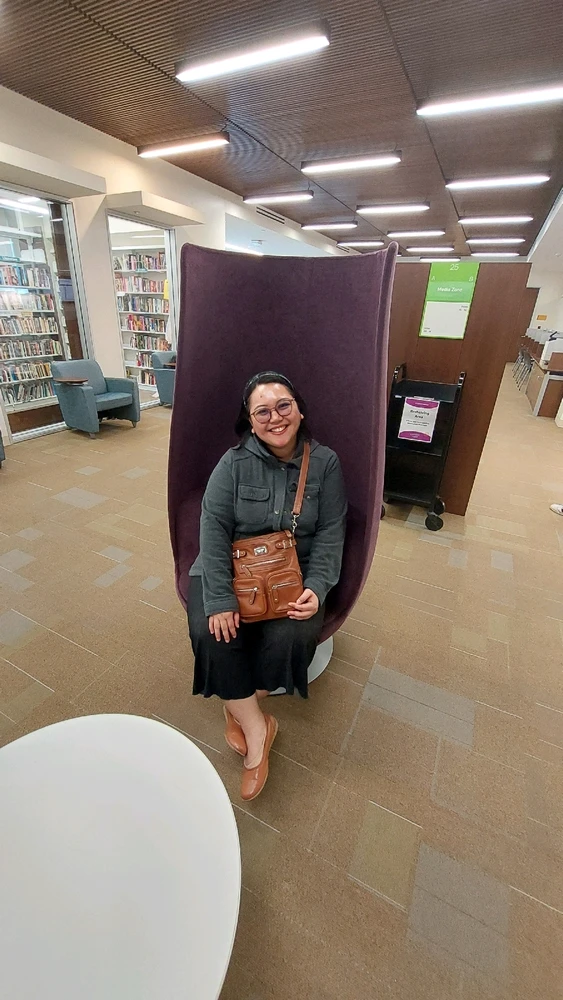 This was taken at the Rowland Heights library. This pretty chair is pretty comfortable. It spins, too! 