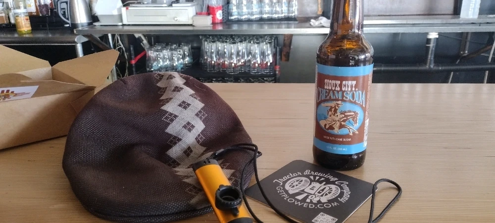 A hat on bar. Kazoo and beer nearby. What could this portend? 