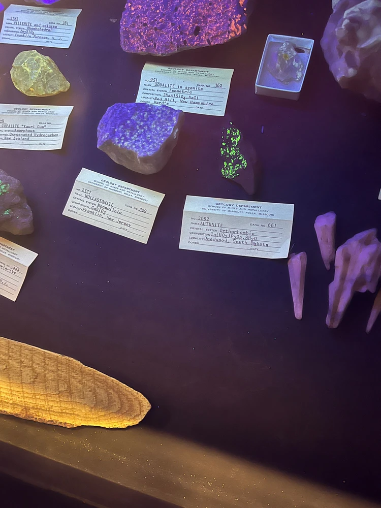 Some of the naturally occurring minerals contain Uranium which when struck with UV light in a dark area can glow!!!