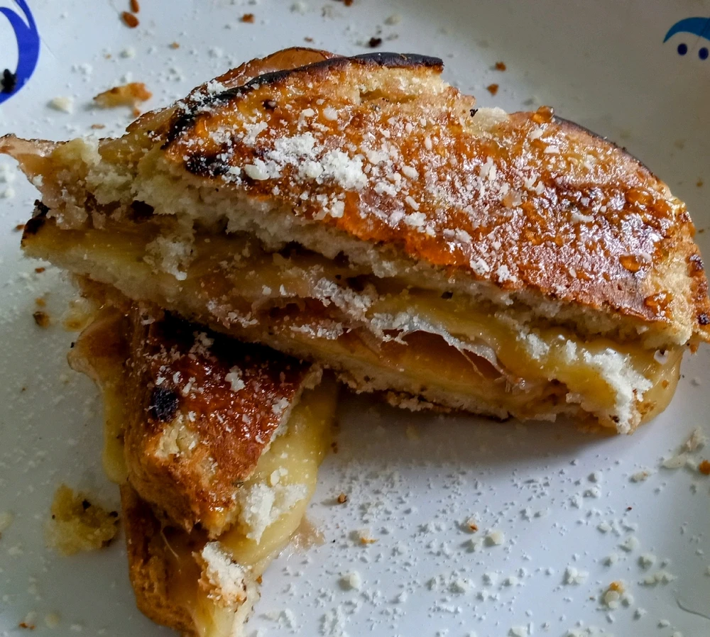 Smoked Gouda and prosciutto ham grilled cheese with fig jam on homemade harddough bread 👌