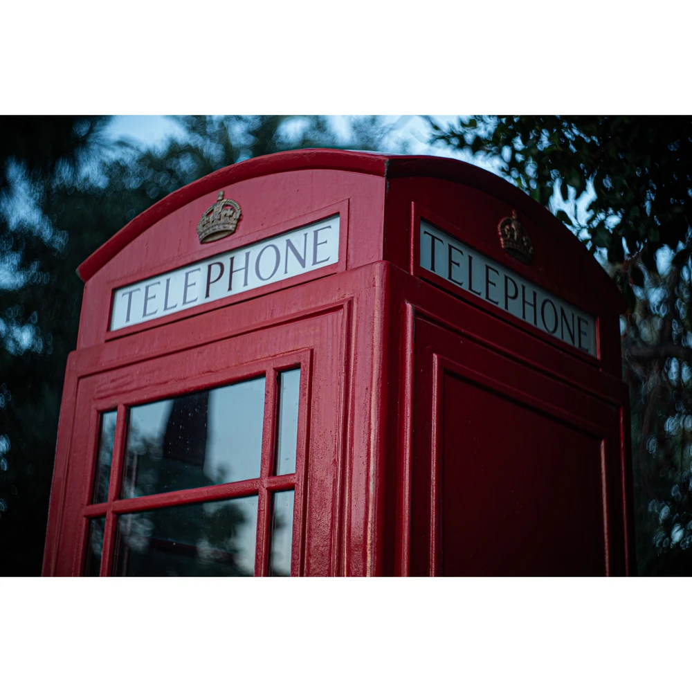 A vintage red phone booth, like you would see in England.