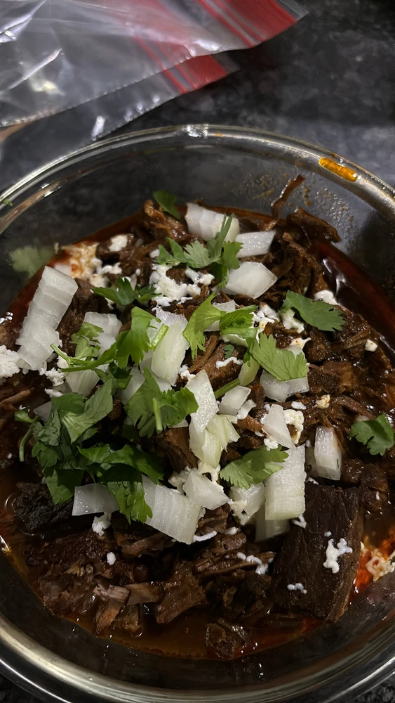 Birria ramen. It’s beef consume, cilantro, onions, tender beef chuck and ramen.