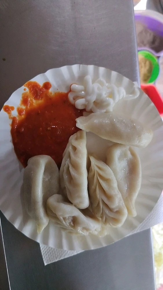 A cozy night with the sound of rain, a cool breeze, and a plate of hot momos . The perfect way to chill weather & relax😋