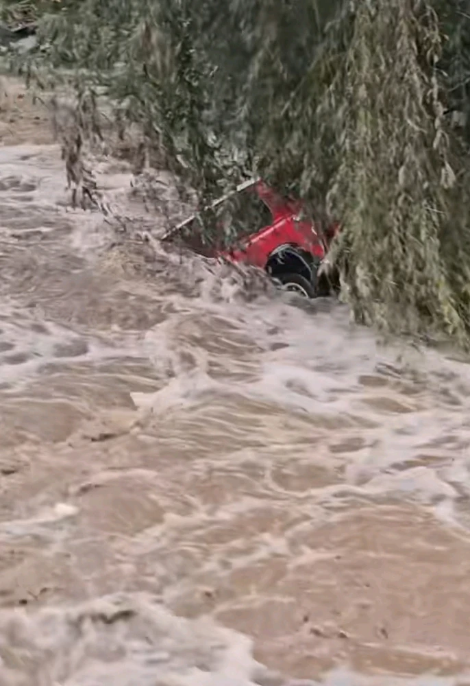 Heavy rain across France inundated several areas, causing widespread flooding that turned roads into rivers and strong currents that carried cars away - including the Mini Cooper seen here being swept away downstream.