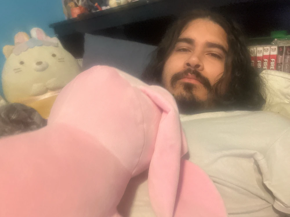 Chilling in bed with a weighted plushie on me.