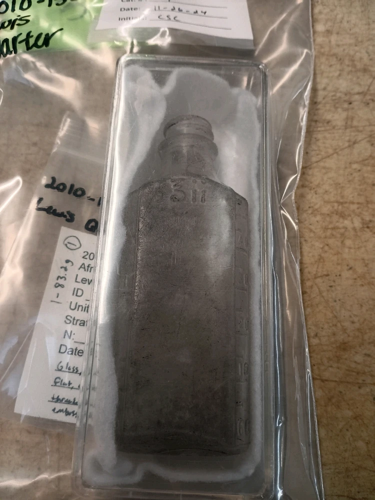 A pharmaceutical bottle found in African American living spaces near Mobile, AL. 