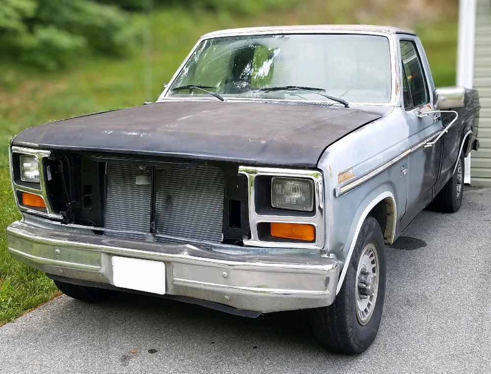 Day 1 of this truck. 
Paint was faded with rattle can black all over it.  The grill was missing & alignment was out of whack!