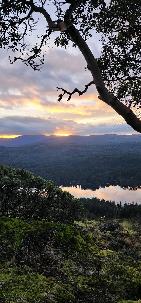 A view of the blazing sunset over Shawnigan Lake, BC, from the top of Ol' Mount Baldy.