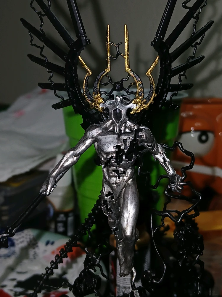 Starded adding gold paint to the horns, and painted the body silver with a black wash