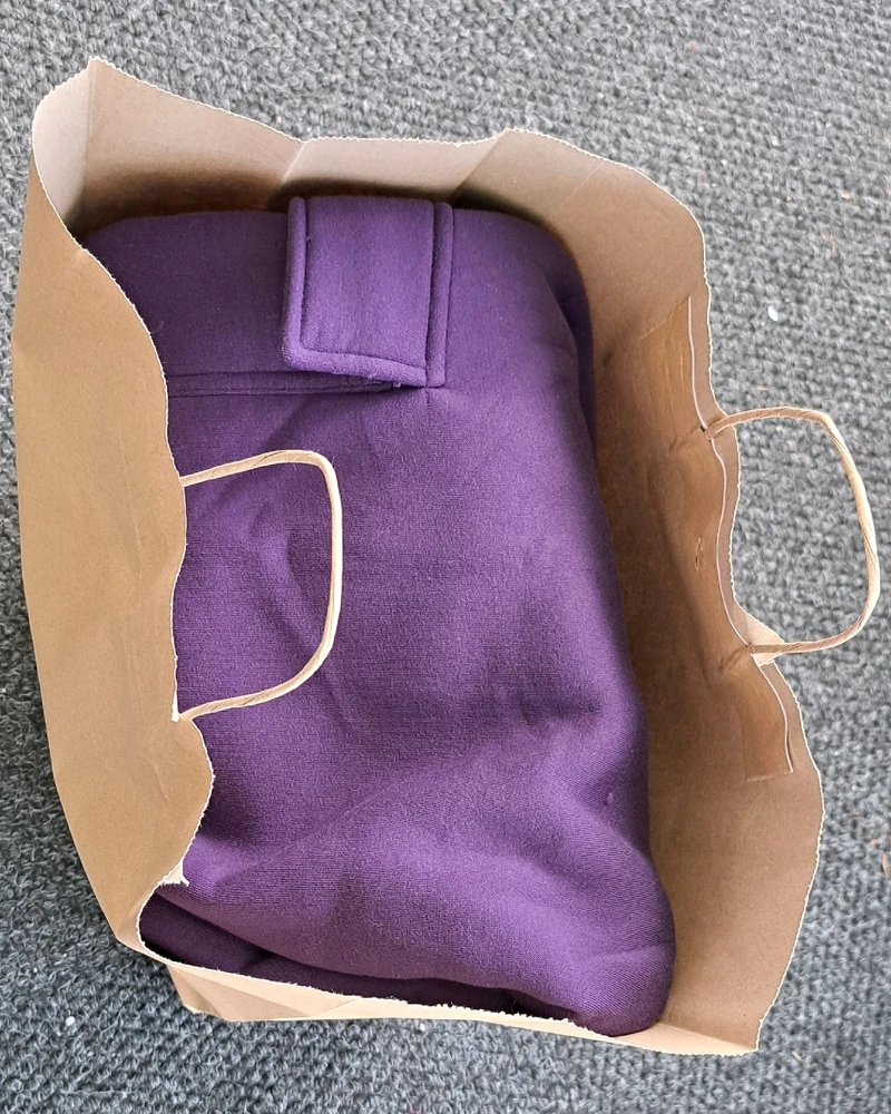 shopping bag full of purple sweatsuit