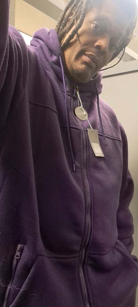 small giant wearing purple hoody