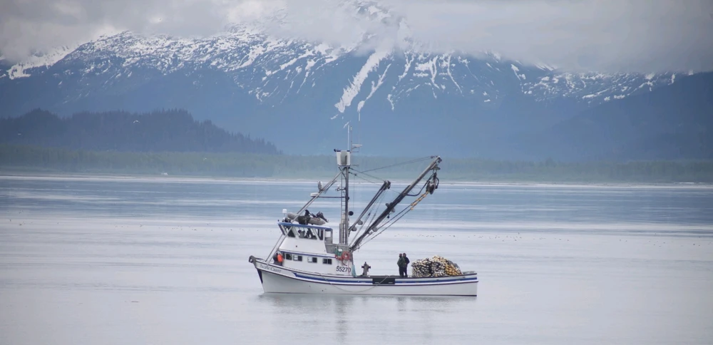 Fishing Boat in Port Valdez with the southern Chugach Mountain Range in the background.