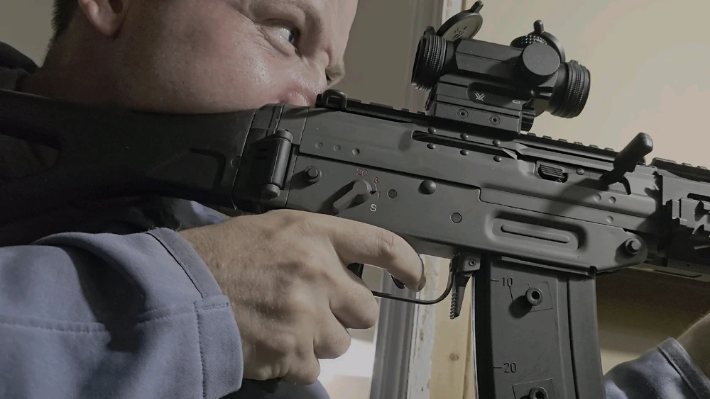 I didn't realize that I look this aggressive. GHK Sig 551 Tactical. All steel w/ Cerakote. Vortex Spitfire AR optic. 