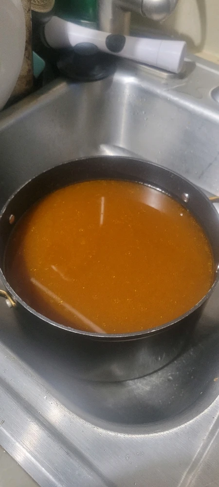 Strained beef bone broth.