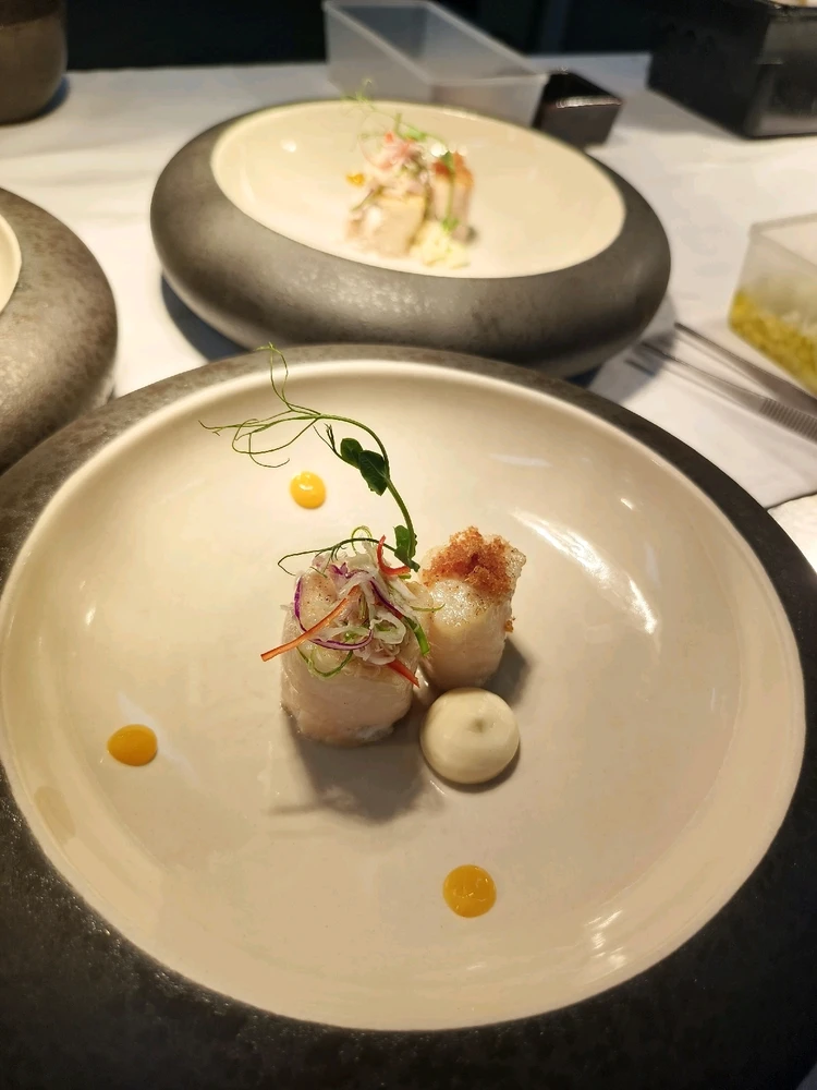 Rolled Barramundi with cauliflower puree & pumpkin puree