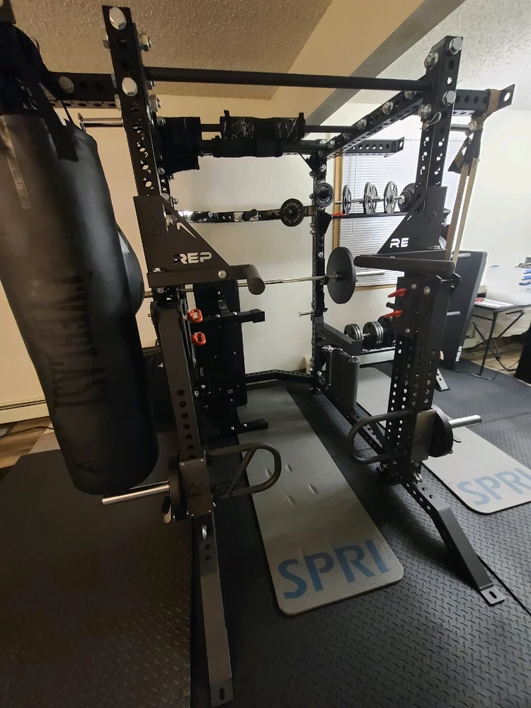 Dip bars, pull up bars, heavy bags attached, bench press, dumbbell storage, jammer arms equipped for squats & shoulder press