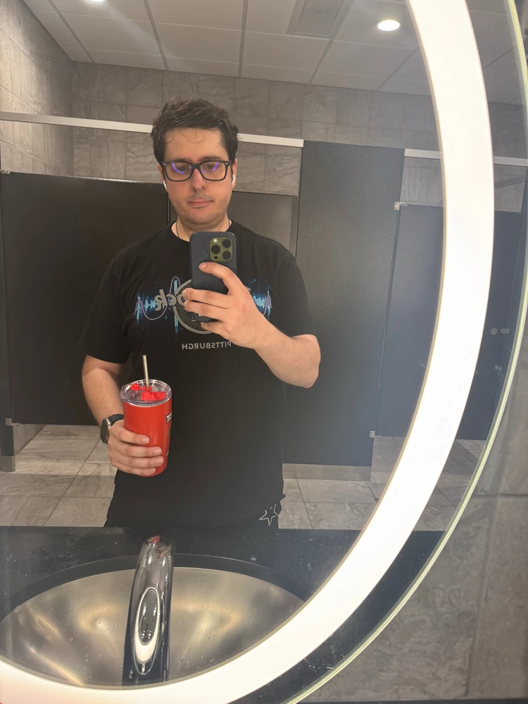 Me holding a one piece Luffy cup my brother got me. 
