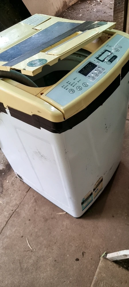 Crummy old washing machine that decided it can't fill, or wash things properly. 