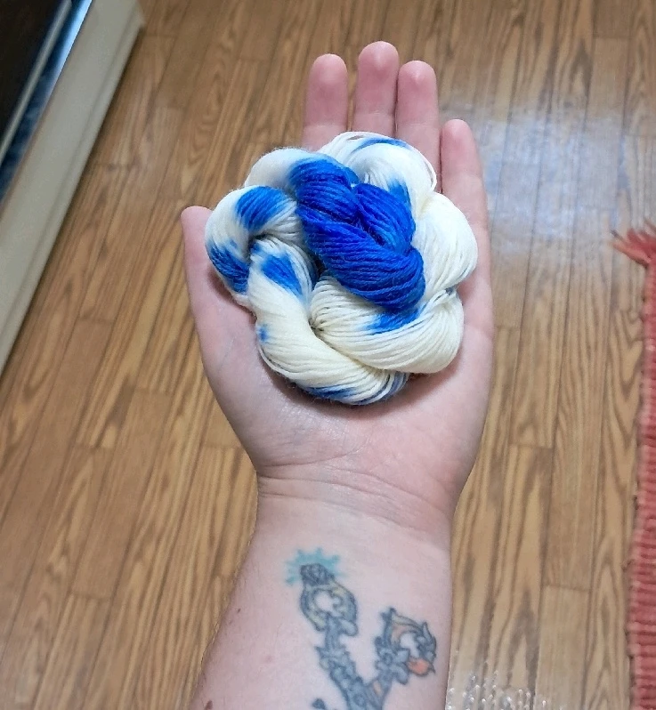 White yarn with blue spots