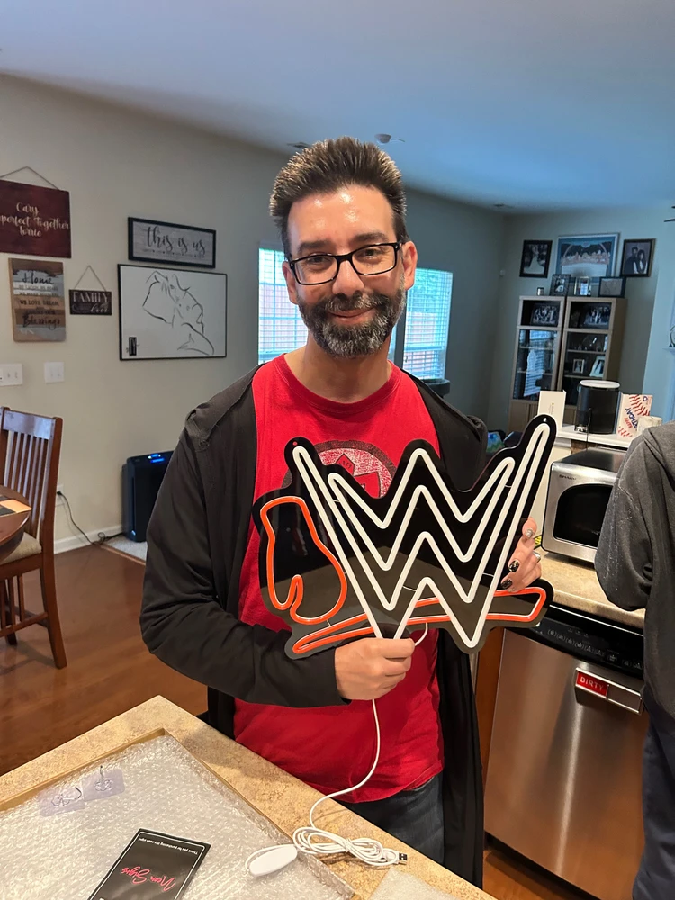 Dad with his birthday 🎁 gift a WWE sign 
